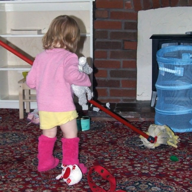 Isabel, 18 months, "mopping" the carpet