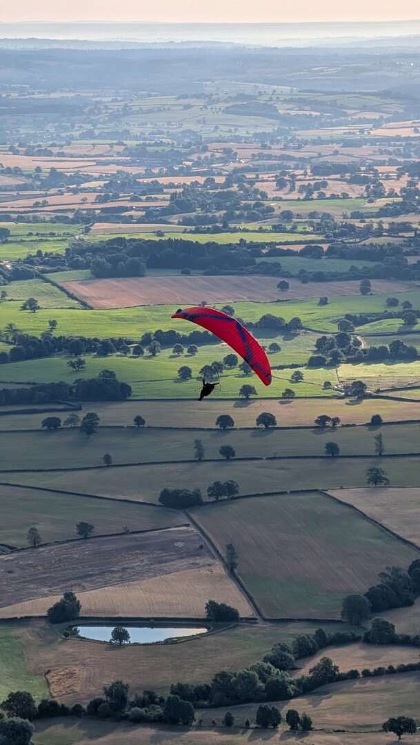 A photo of a paraglider who went round the balloon in a big loop